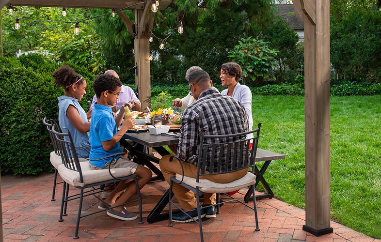 family grilling outside