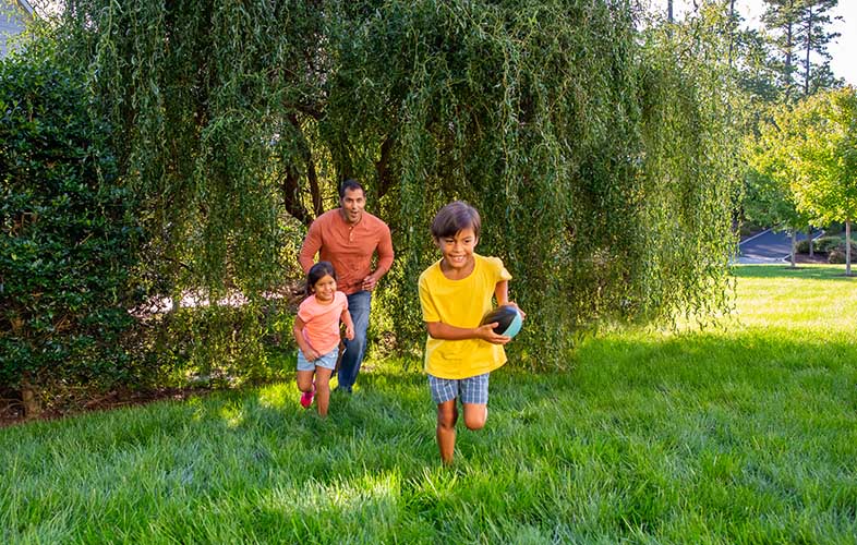 family playing on lawn